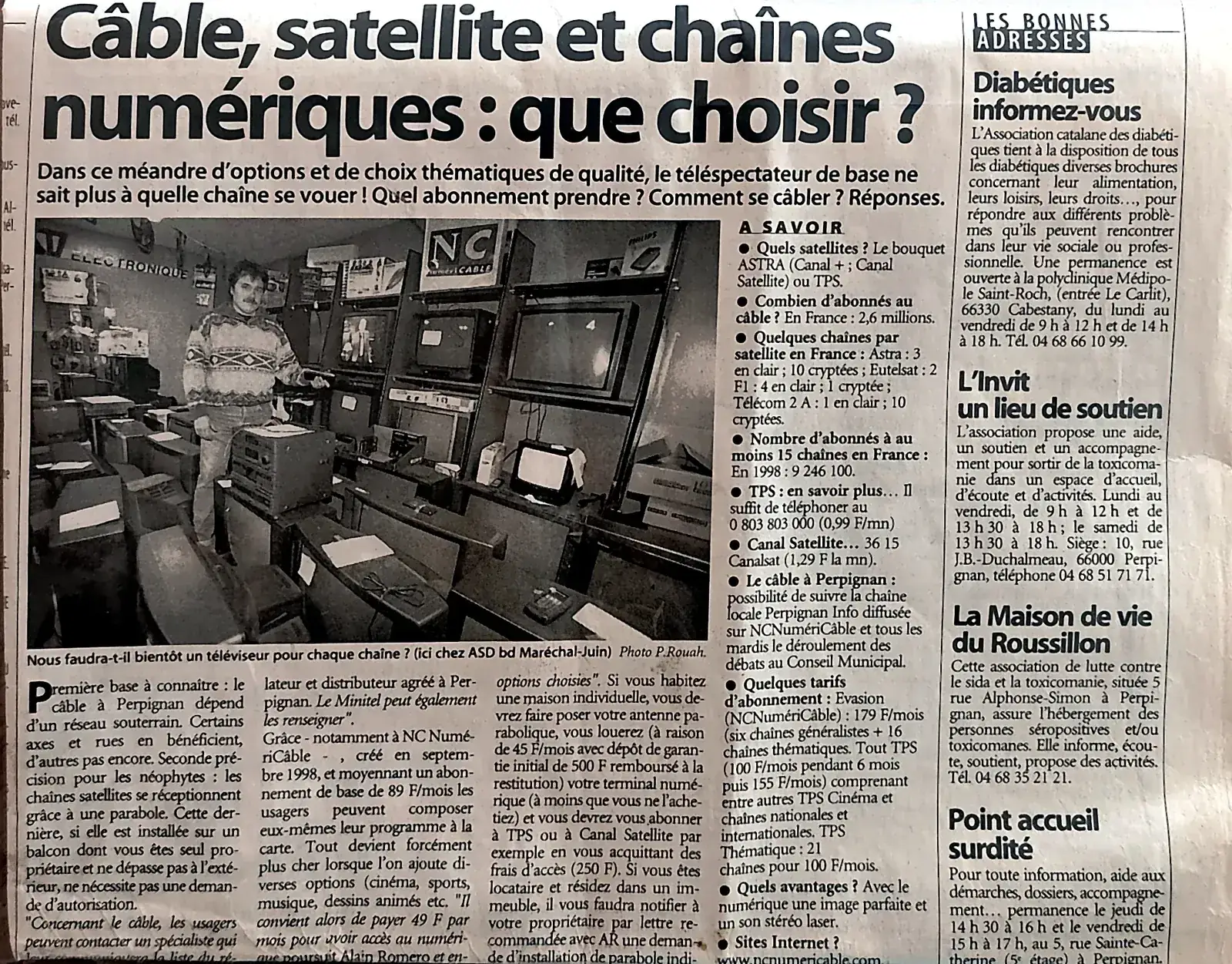 Article de L'Indépendant du 3 février 2000 « Câble, satellite et chaînes numériques : que choisir ? » photographié dans l'atelier de réparation ASD Electronique à Perpignan